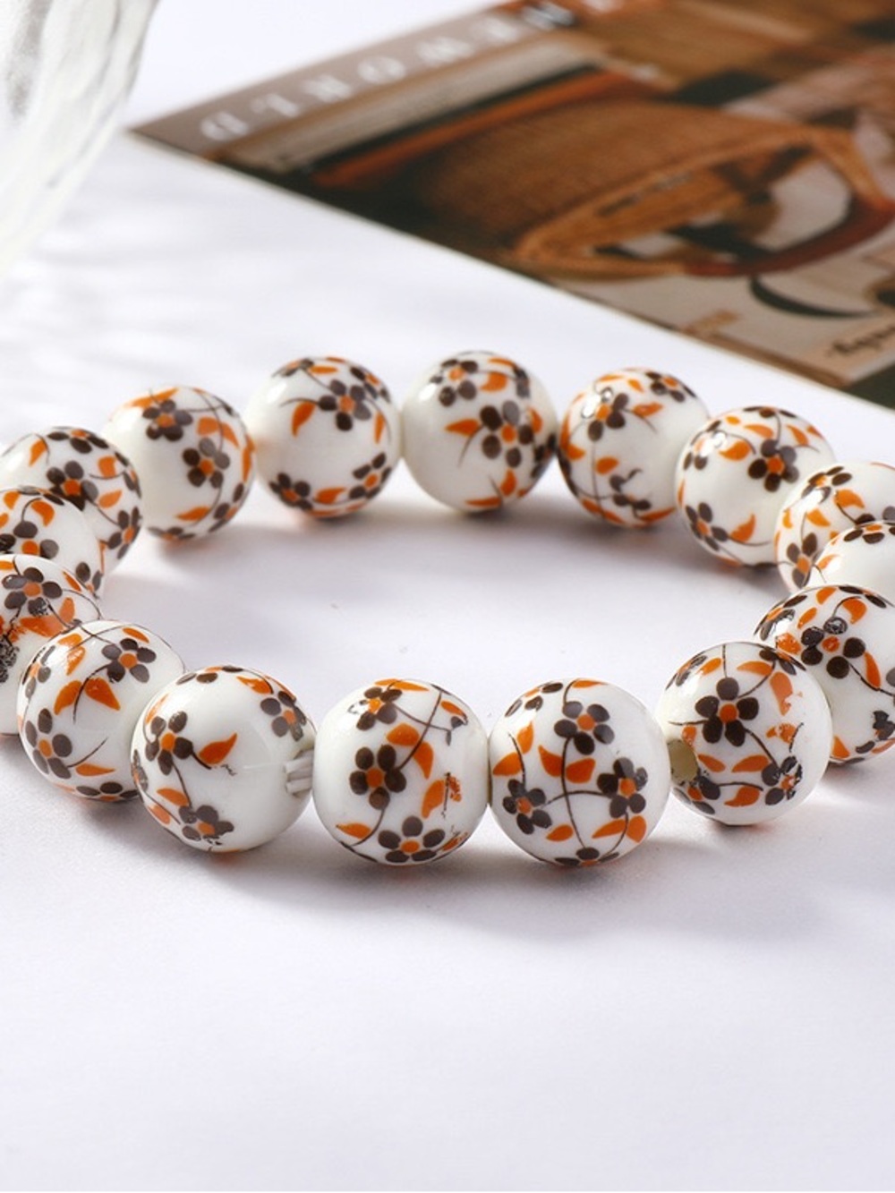 Porcelain Floral White Ceramic Bead Bracelet with Orange Accents